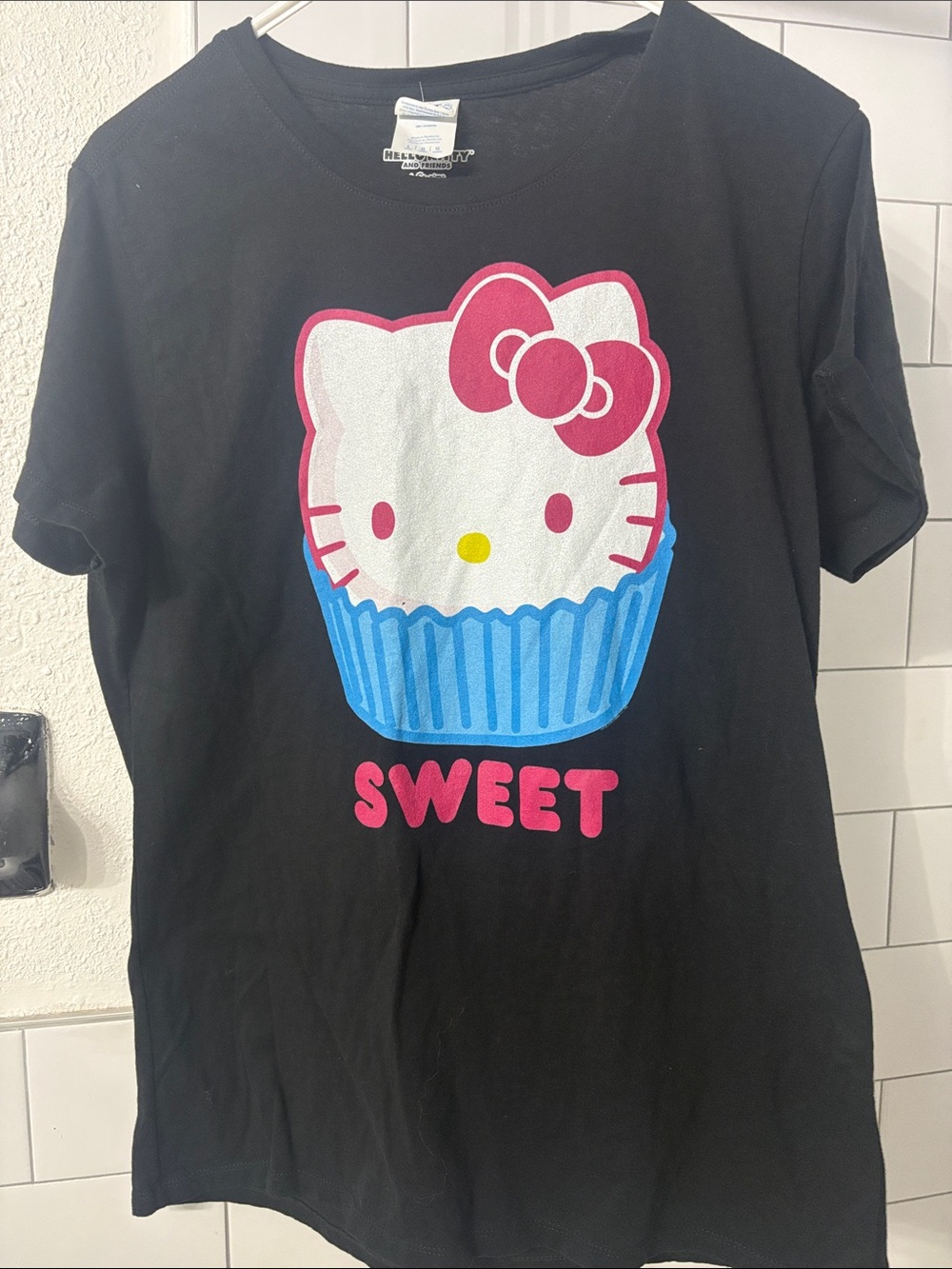 Hello Kitty Black Tee with Pink Bow and Blue Cupcake Graphic